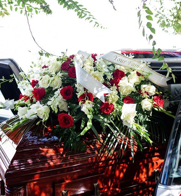 Funeral Flowers On The Casket — Quality Cremation Services in Rockhampton, QLD