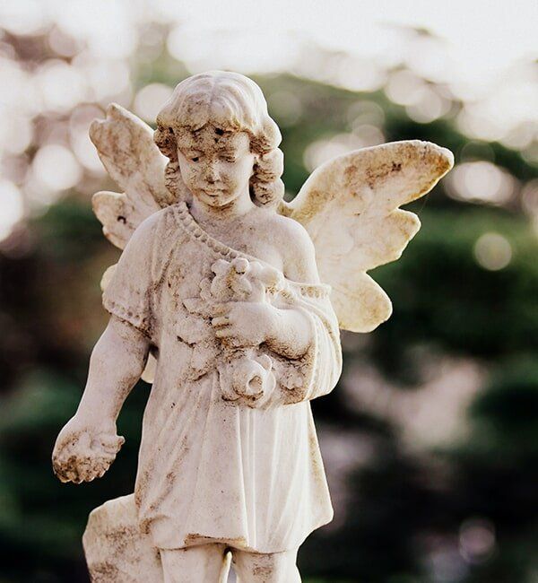 Old Angel Statue — Quality Cremation Services in Rockhampton, QLD