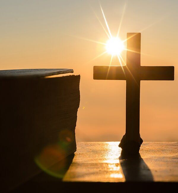 Cross And A Book — Quality Cremation Services in Rockhampton, QLD