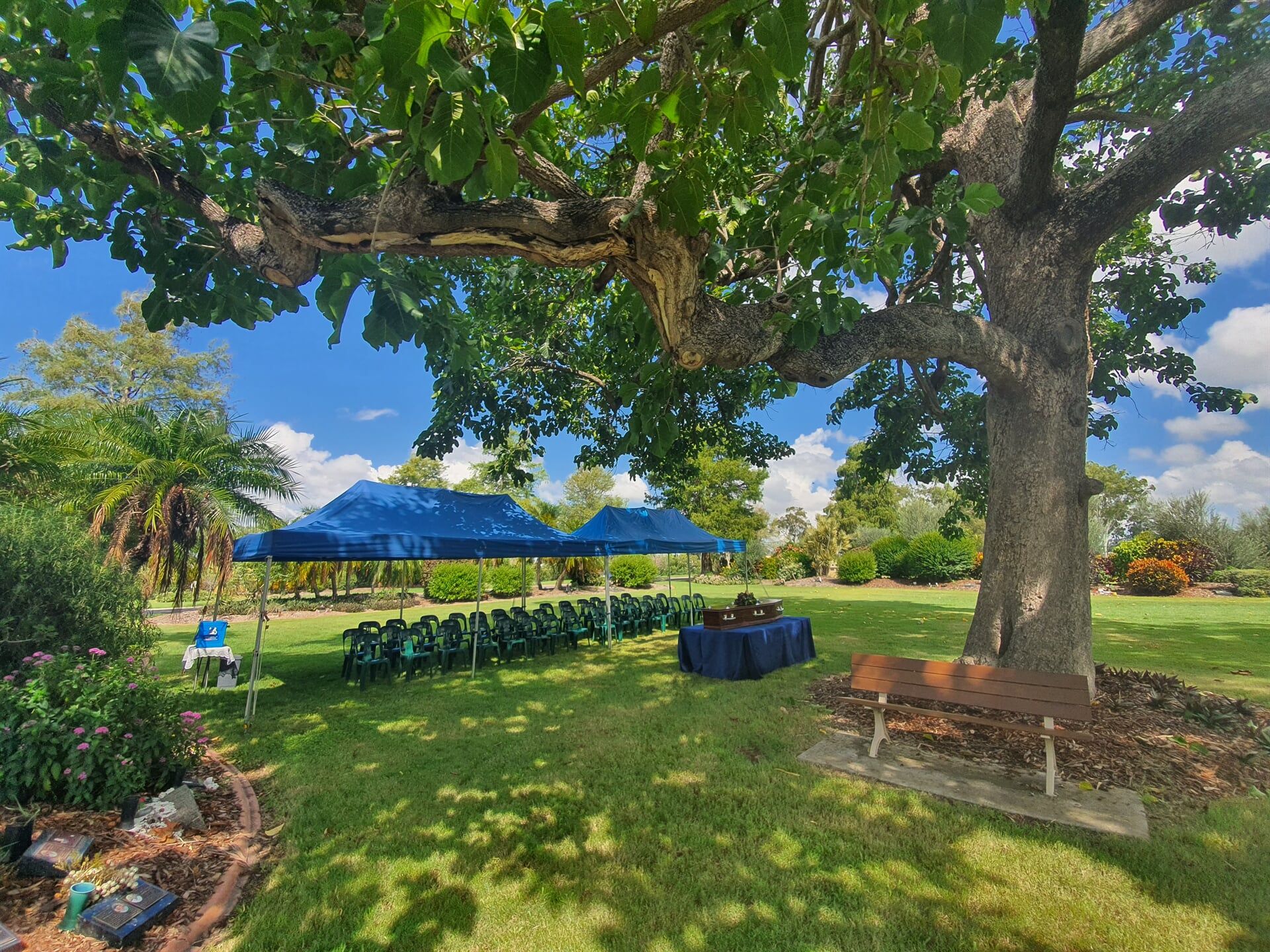 Urn, Candle And A Picture Frame On A Table — Quality Cremation Services in Rockhampton, QLD