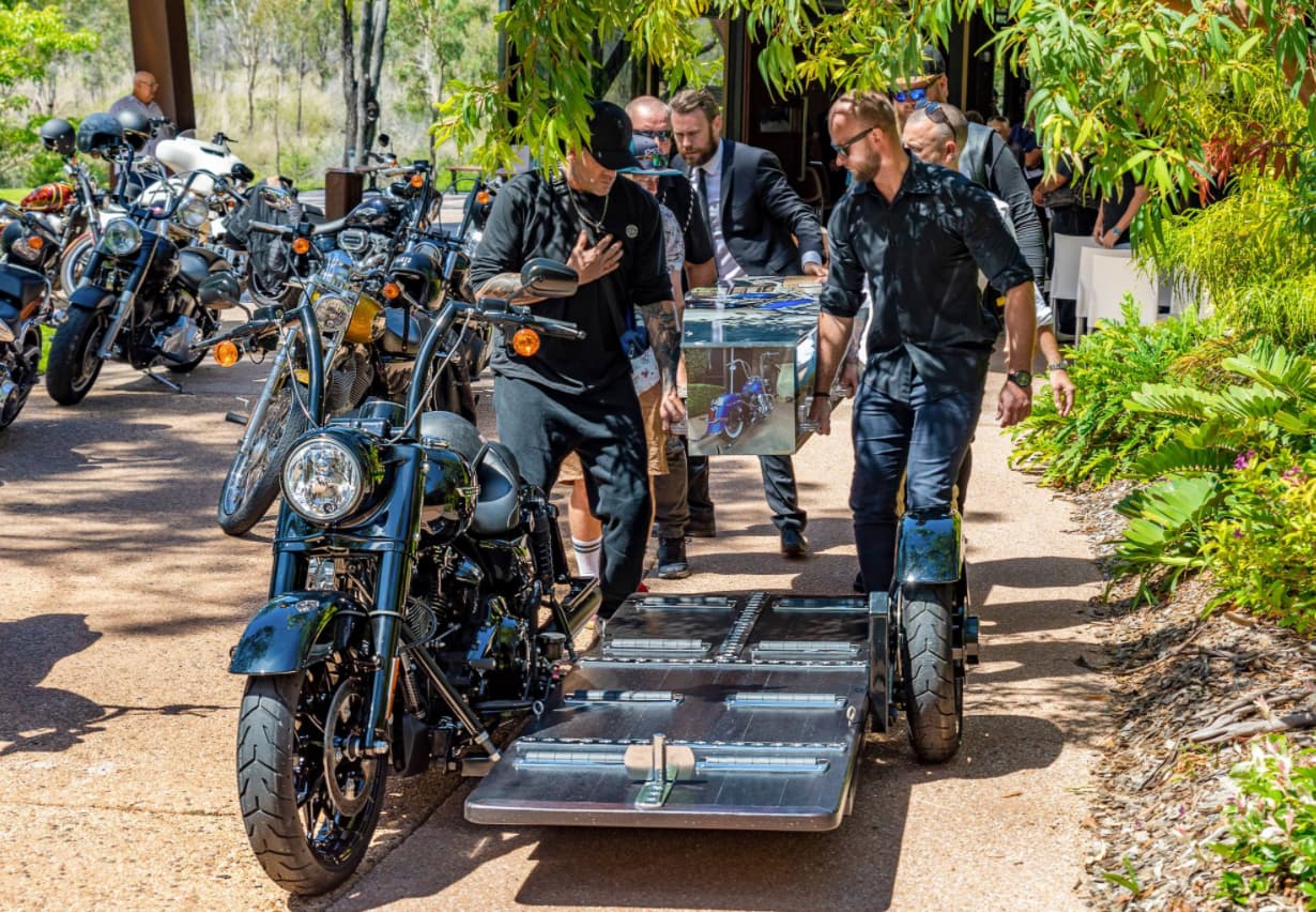 Putting The Coffin On The Motorbike — Quality Cremation Services in Rockhampton, QLD