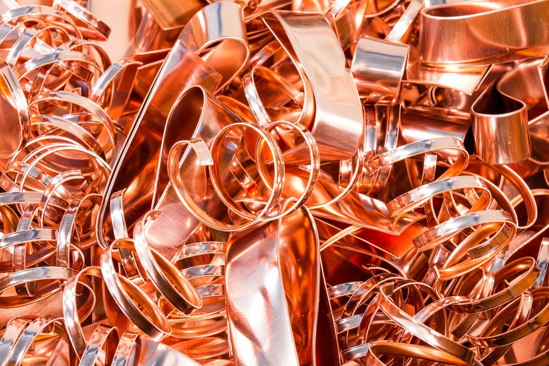 A pile of copper scrap is sitting on a table.