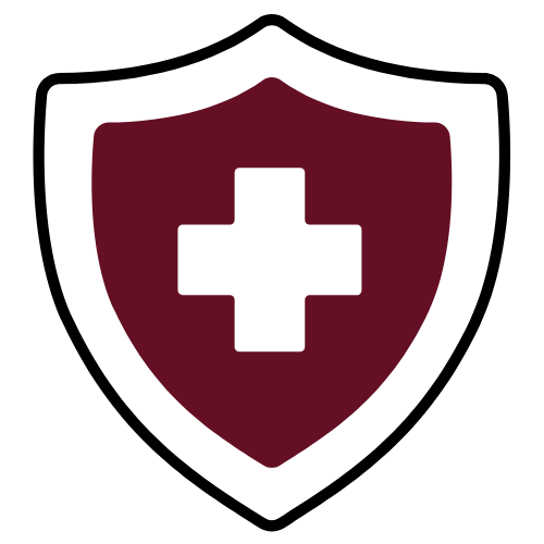 Person in red blazer holding a pen and phone, looking at a miniature house on a desk with documents.