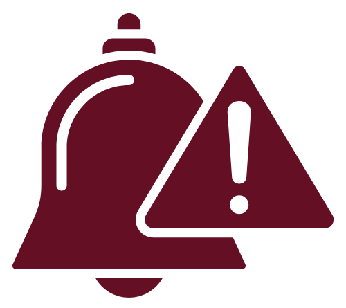 Person in red blazer holding a pen and phone, looking at a miniature house on a desk with documents.