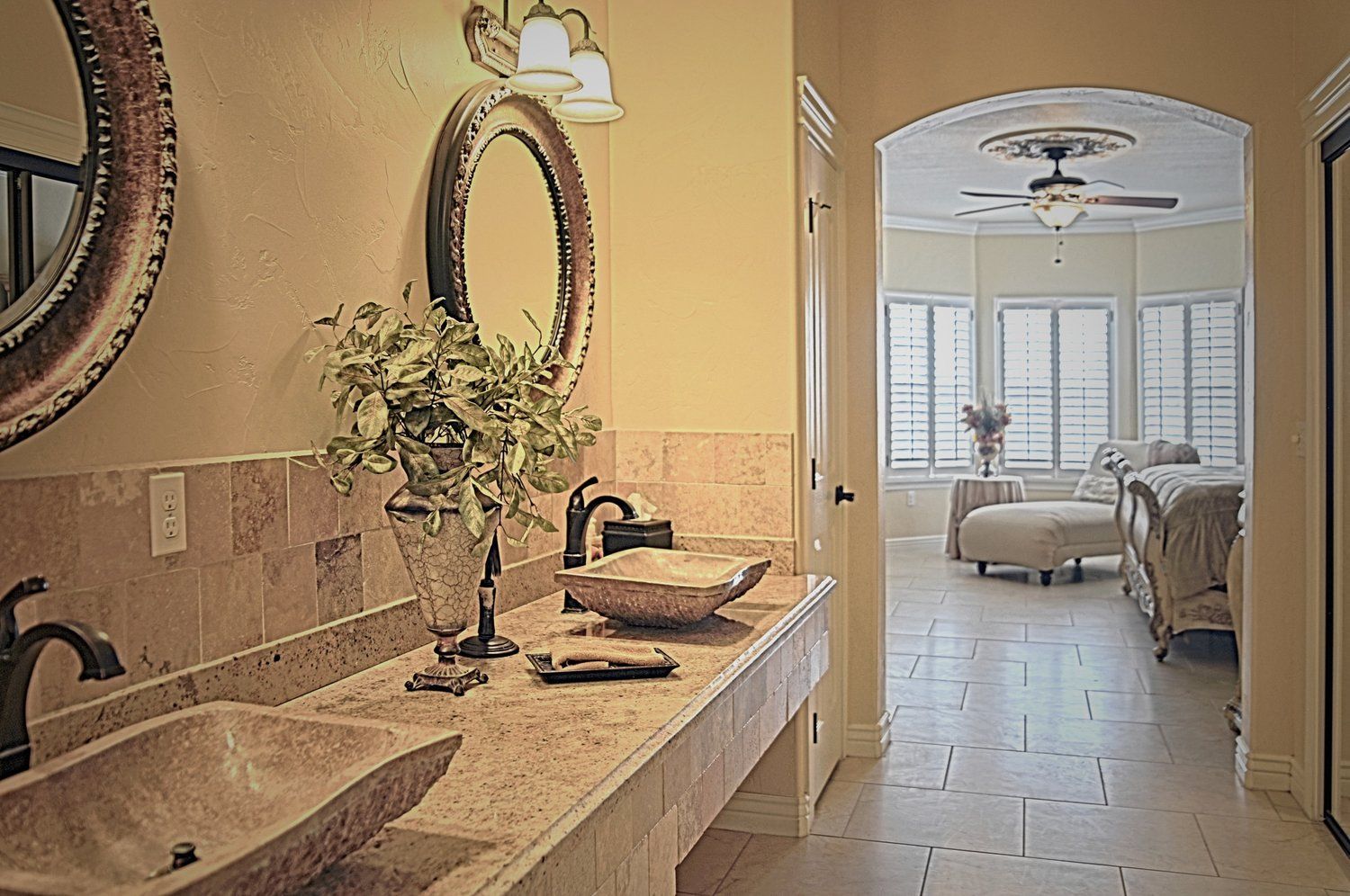 A bathroom with two sinks and two mirrors