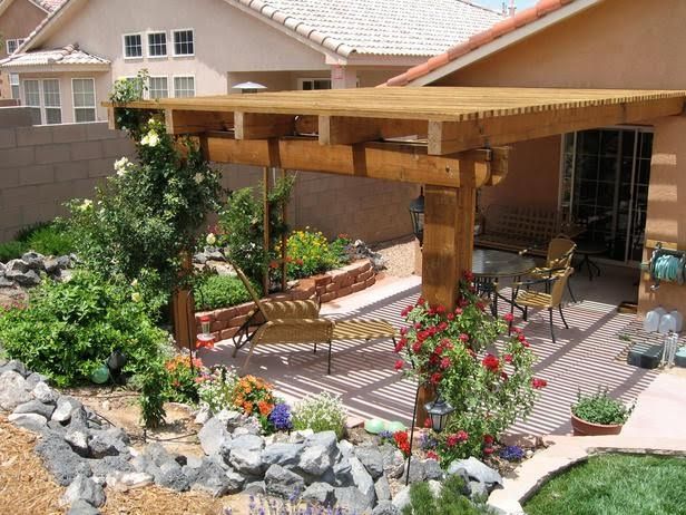 A house with a pergola in front of it