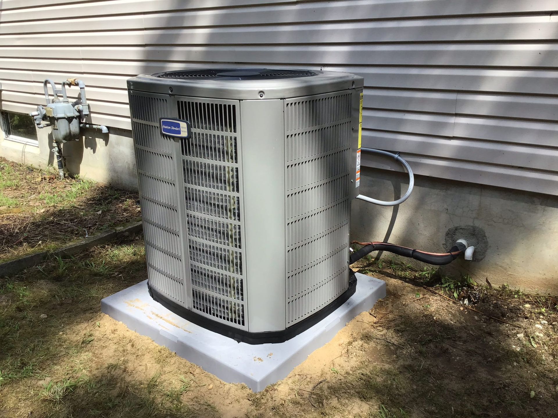 A basement with a water heater and a furnace.