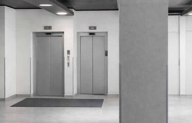 Minimalist commercial lobby with elevators