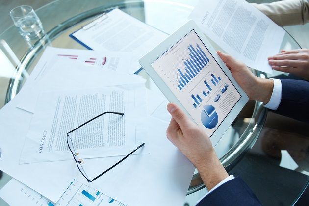 businessman-holding-tablet-with-statistical-data