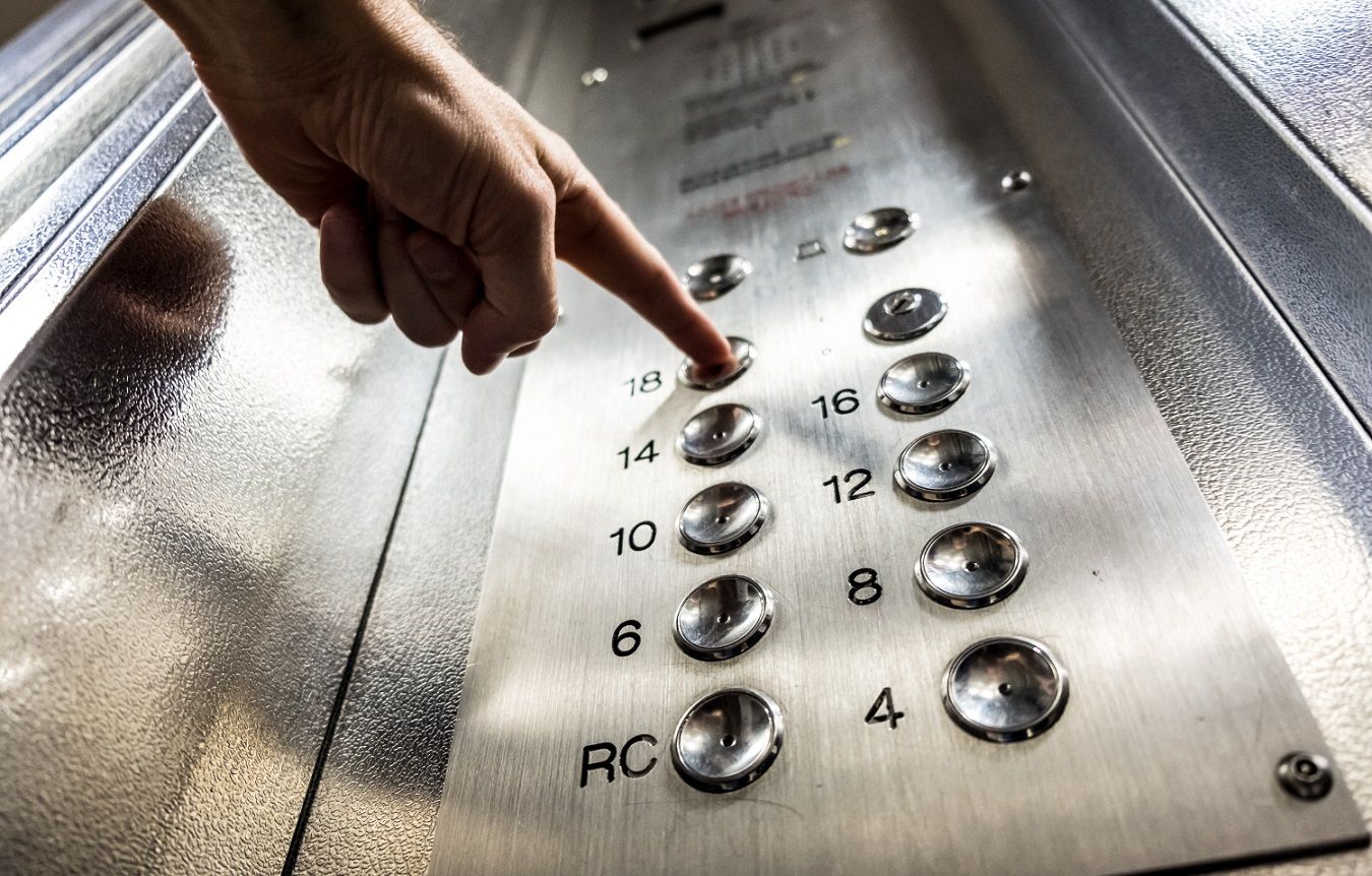 close-up shot of pressing an elevator button