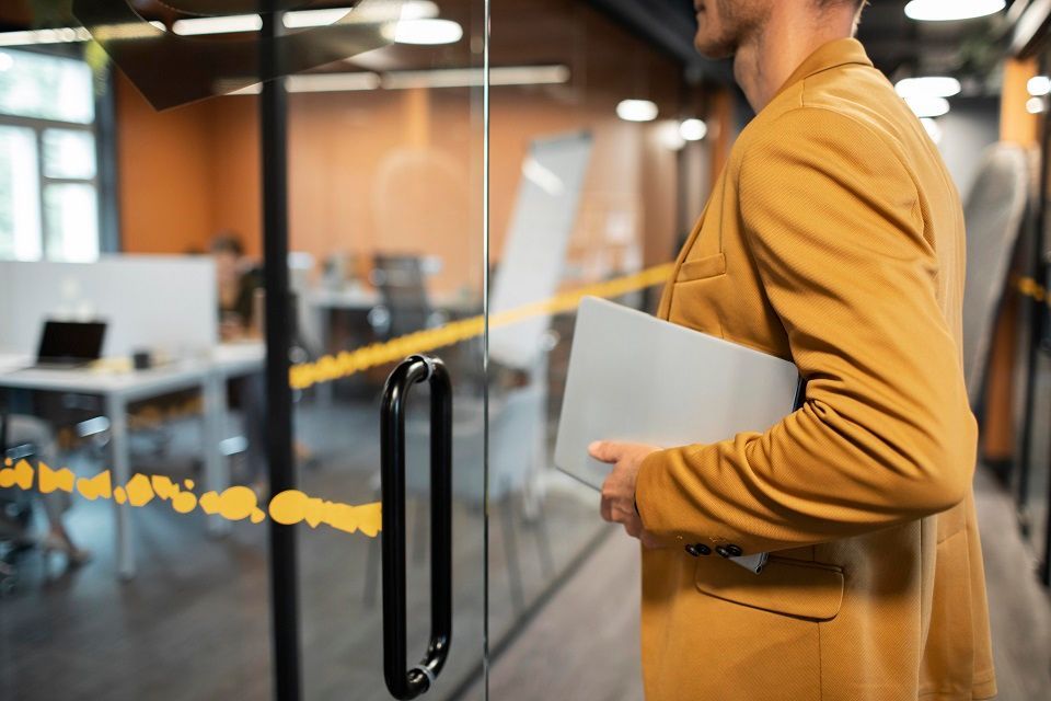 close-up-man-carrying-laptop