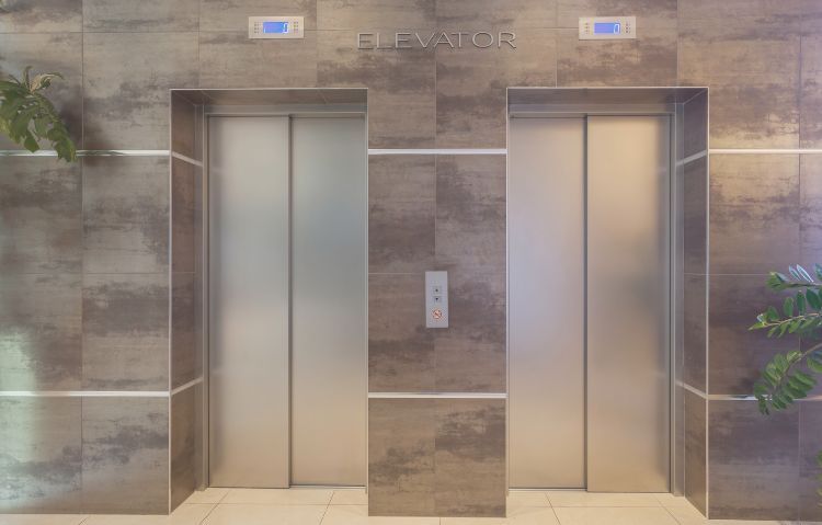 Elevator in a modern lobby with sleek design.