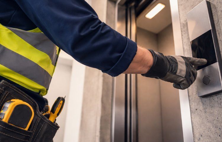 elevator maintenance worker in action