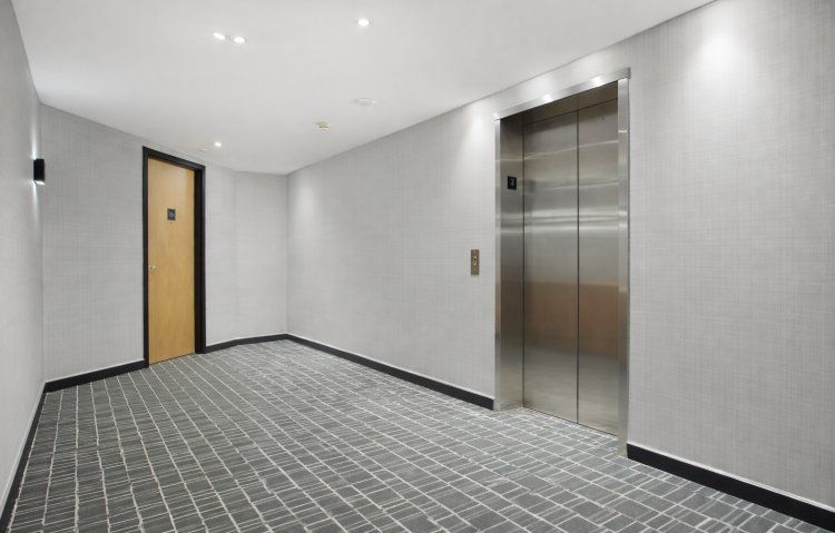 modern hallway with stainless steel elevator