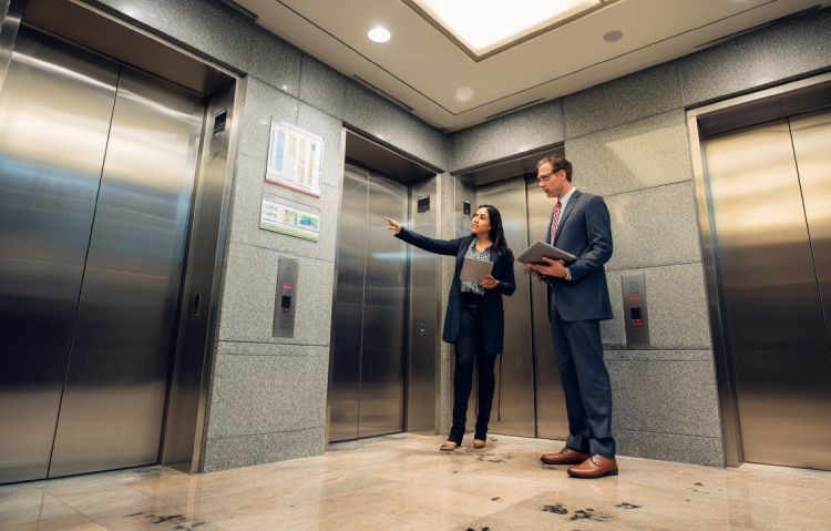 professional elevator consultant reviewing performance data