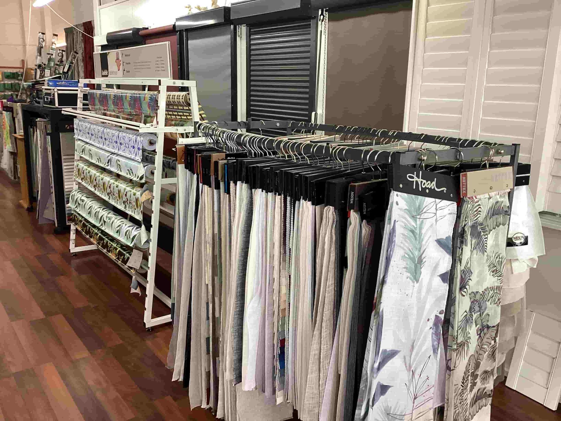 A Display of Curtains and Blinds in a Store — Tully Blinds in Tully, QLD