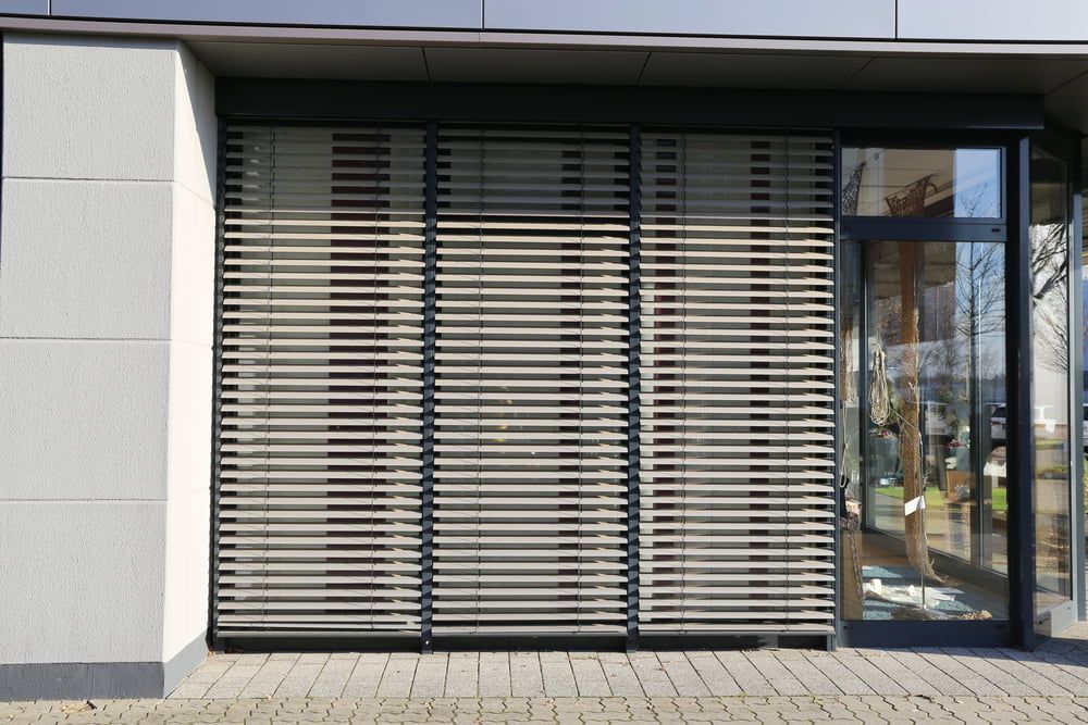 A Building With a Window With Blinds on It — Tully Blinds in Cardwell, QLD