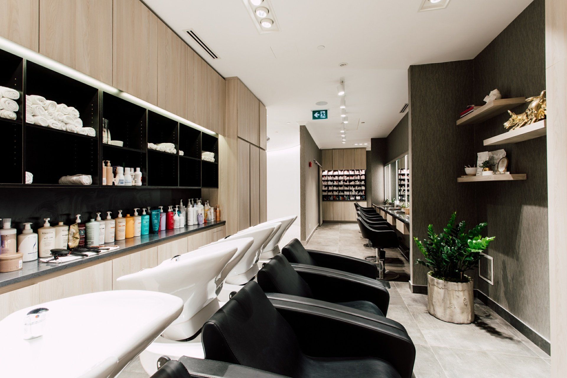 A hair salon with a lot of chairs and sinks