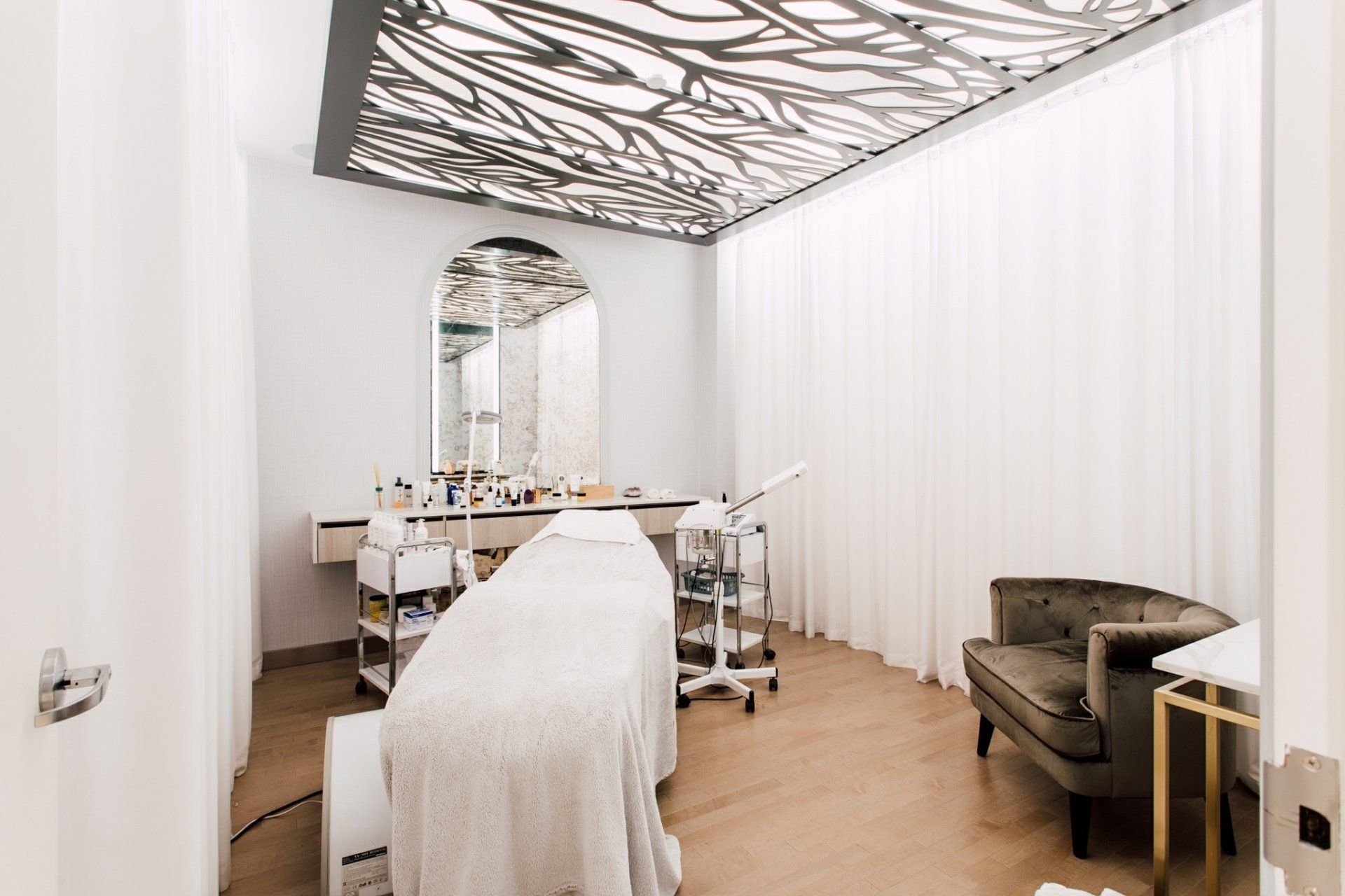 There is a massage table in the middle of the room.