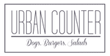 Logo for Urban Counter: text within a rectangle, reads "Urban Counter" above "Dogs. Burgers. Salads" in script.