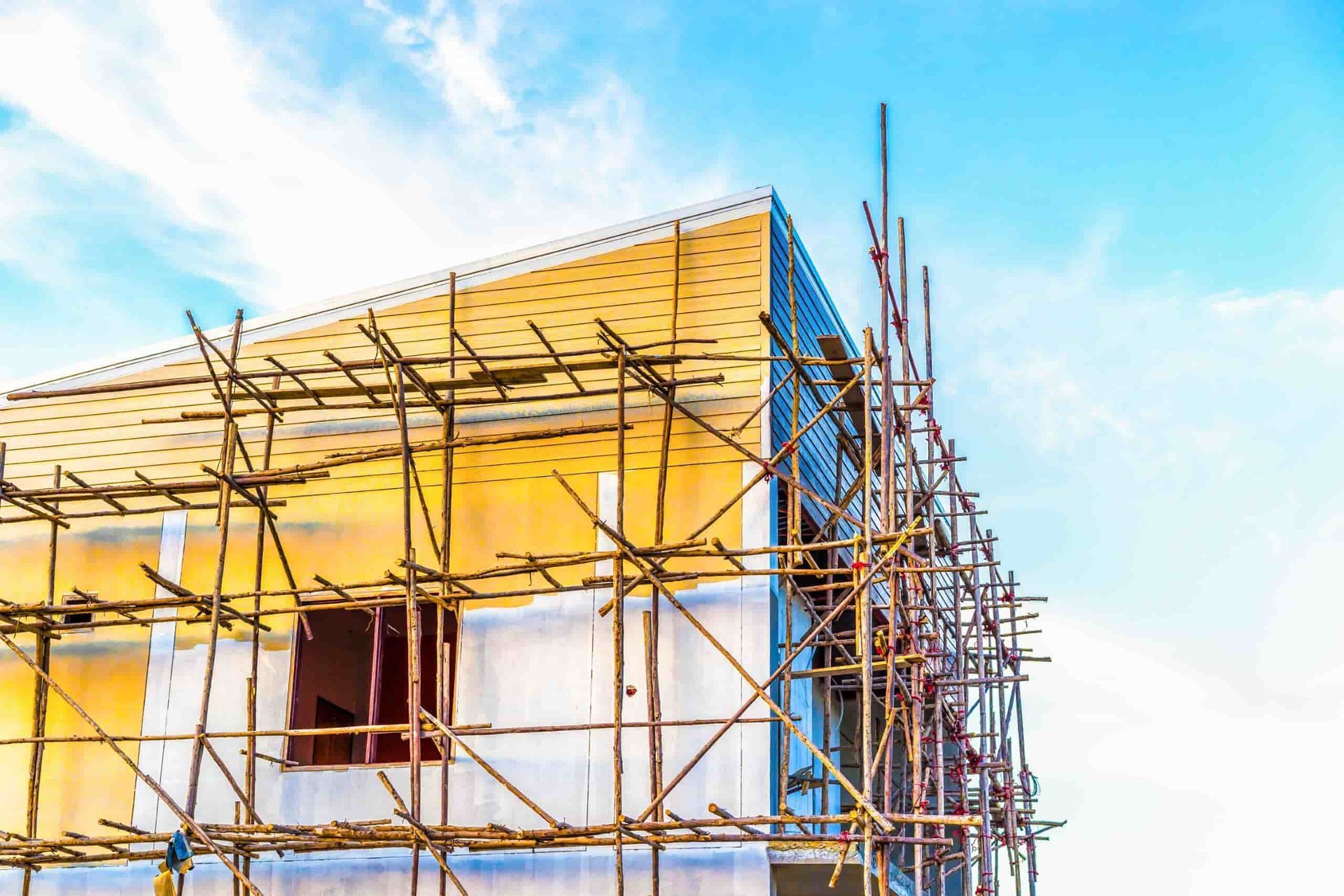 A Building Is Being Built with Scaffolding Around It — Wards Group QLD In Kingaroy, QLD