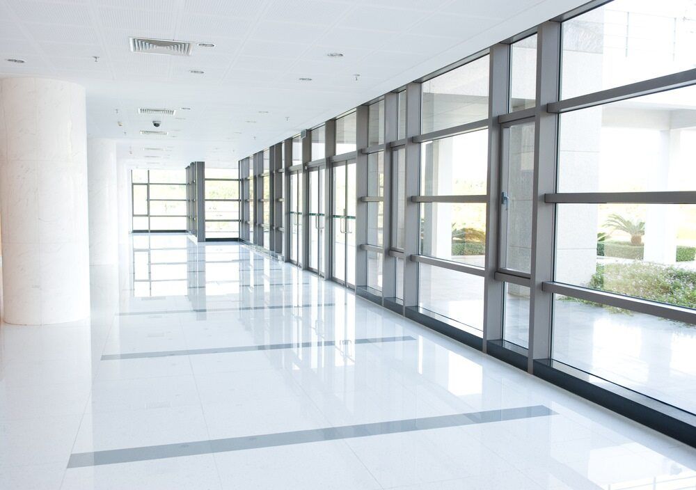 An Empty Hallway With Lots of Windows — Wards Group QLD in Nanango, QLD