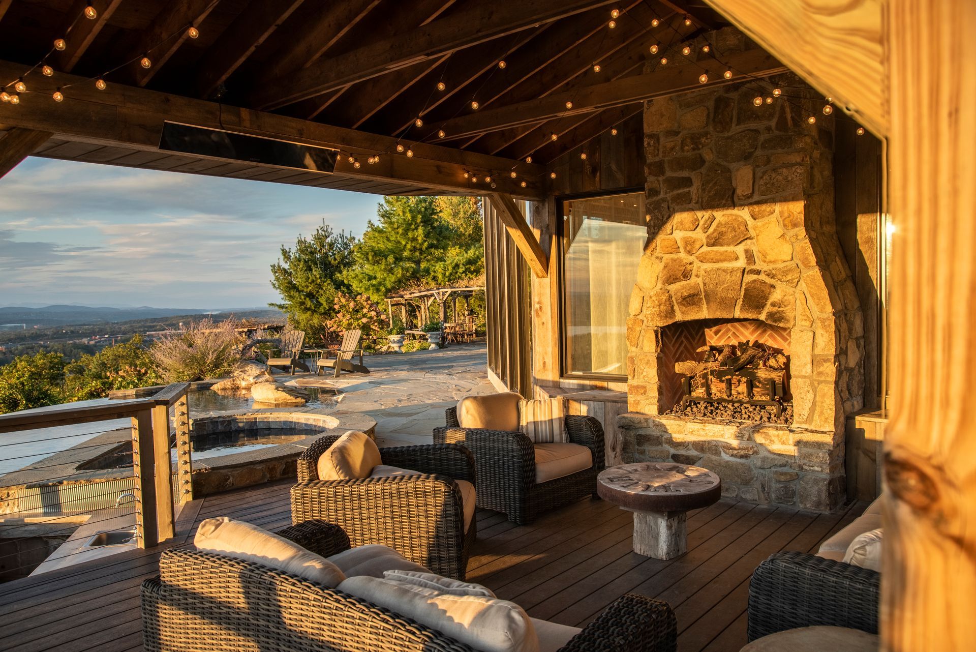 There is a fireplace in the middle of the patio area.