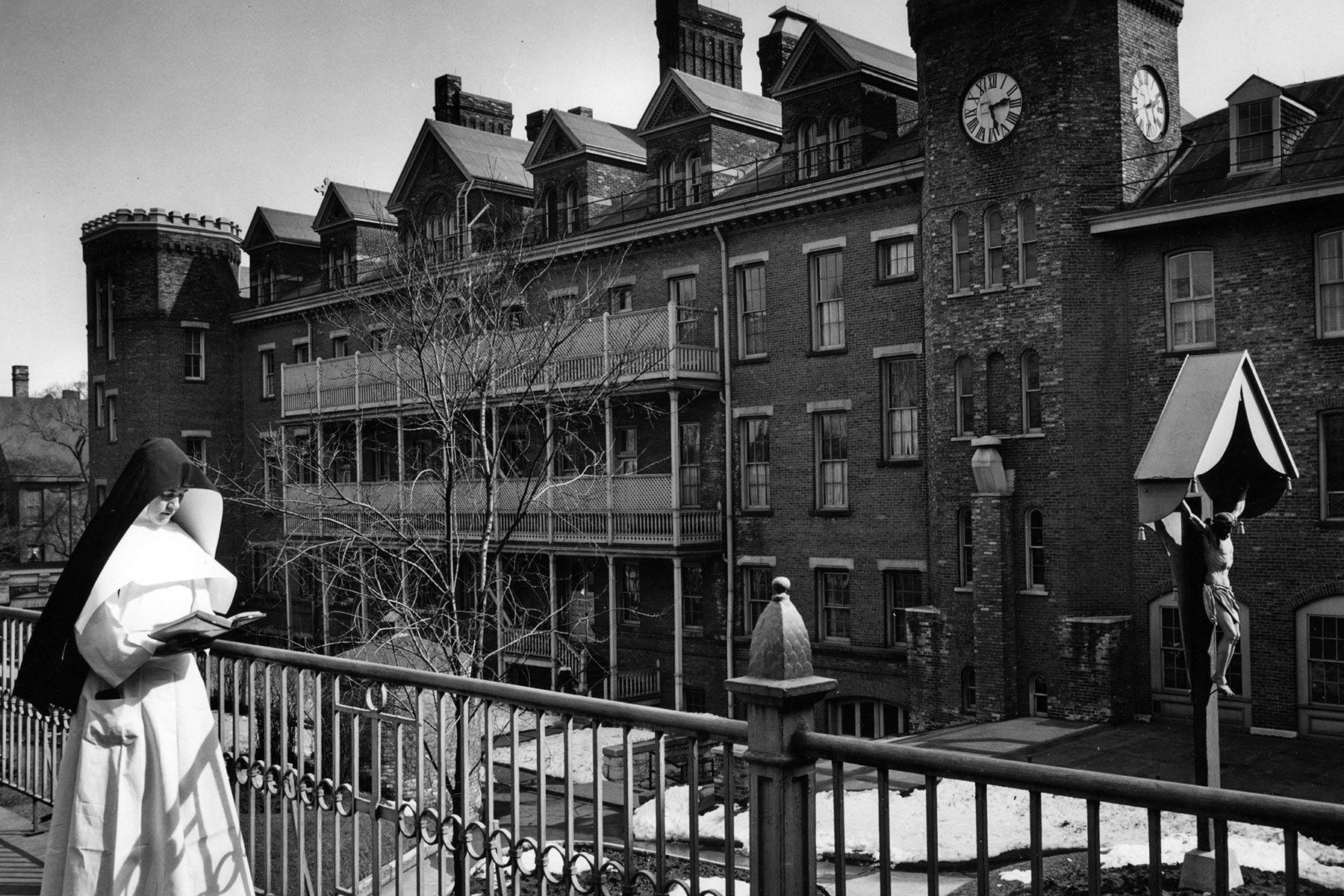 A nun walks past the Motherhouse Convent at Convent Hill in Milwaukee in the 1950s