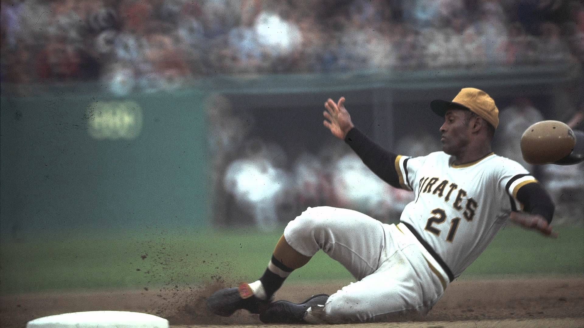 Roberto Clemente sliding into a base