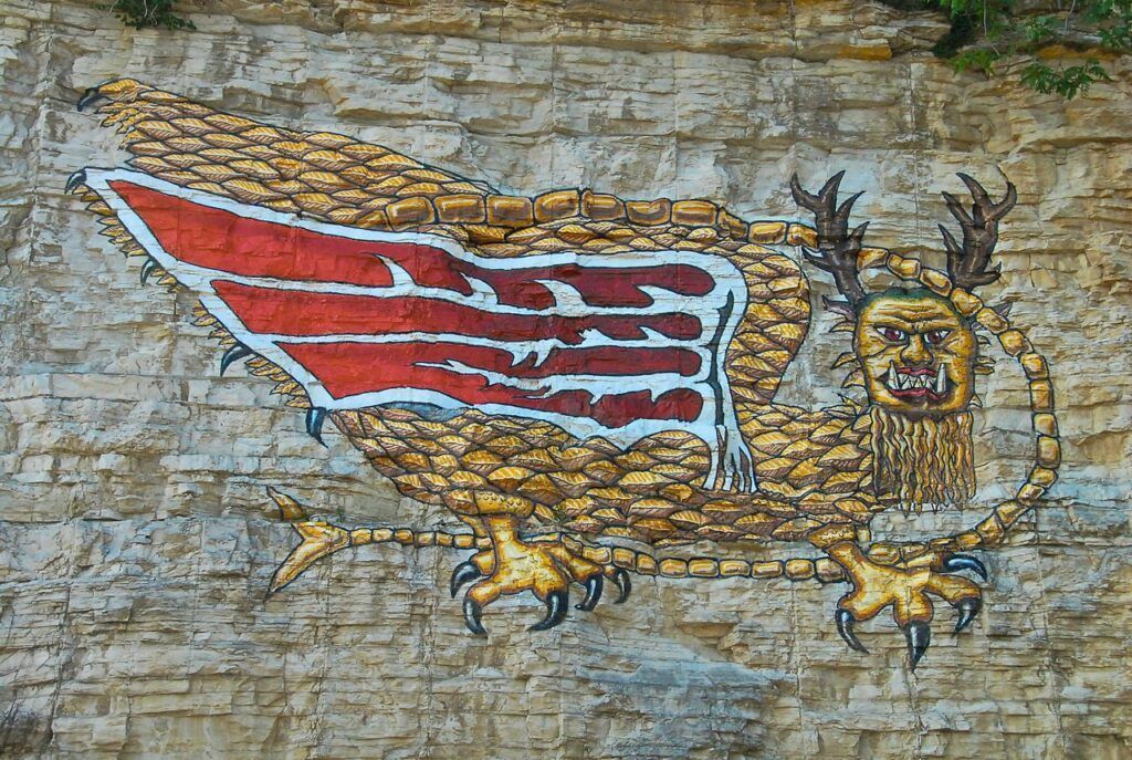 A painting of a griffin on a brick wall