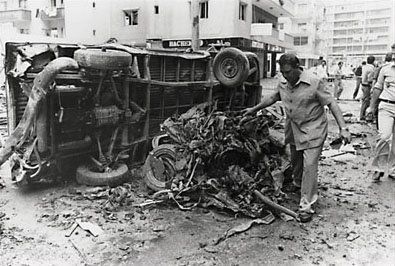 A black and white photo of a car that has been flipped over