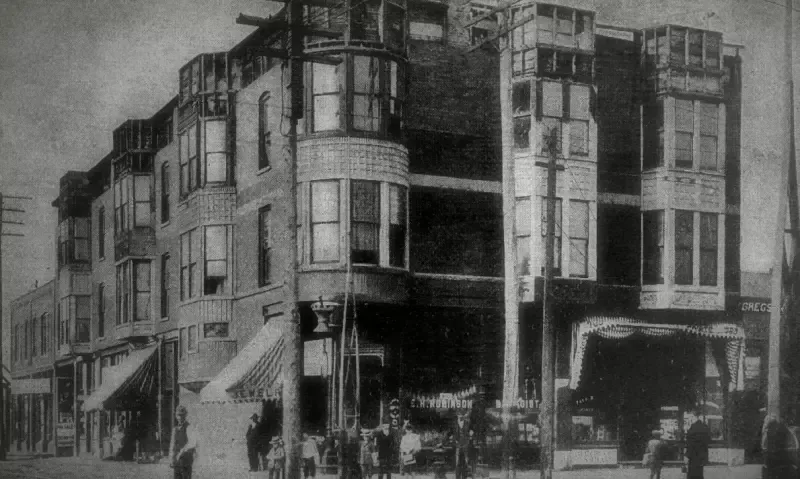 A black and white photo of a brick building