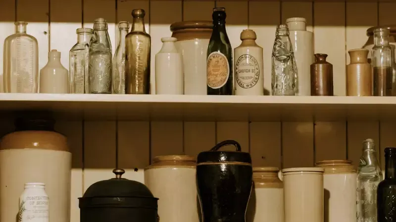 A shelf filled with lots of bottles and jars