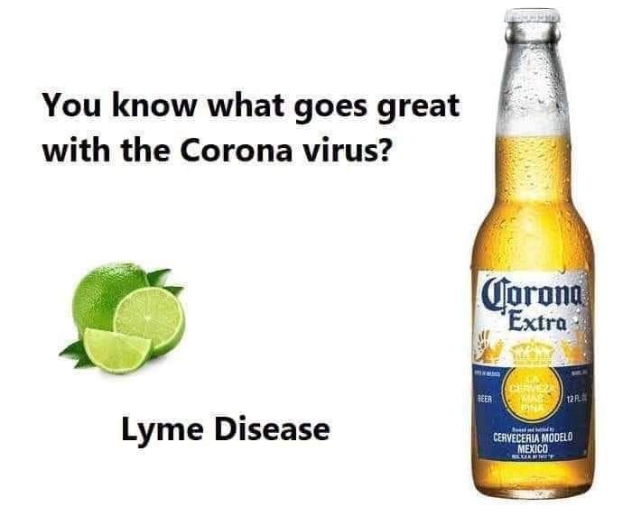 A bottle of corona extra beer next to a lime