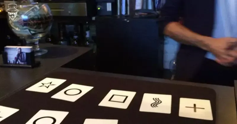 A person is playing a game of cards on a table