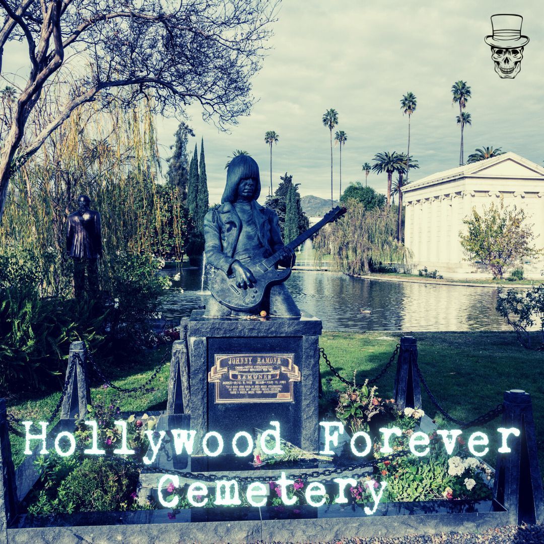 Hollywood forever cemetery has a statue of a man holding a guitar