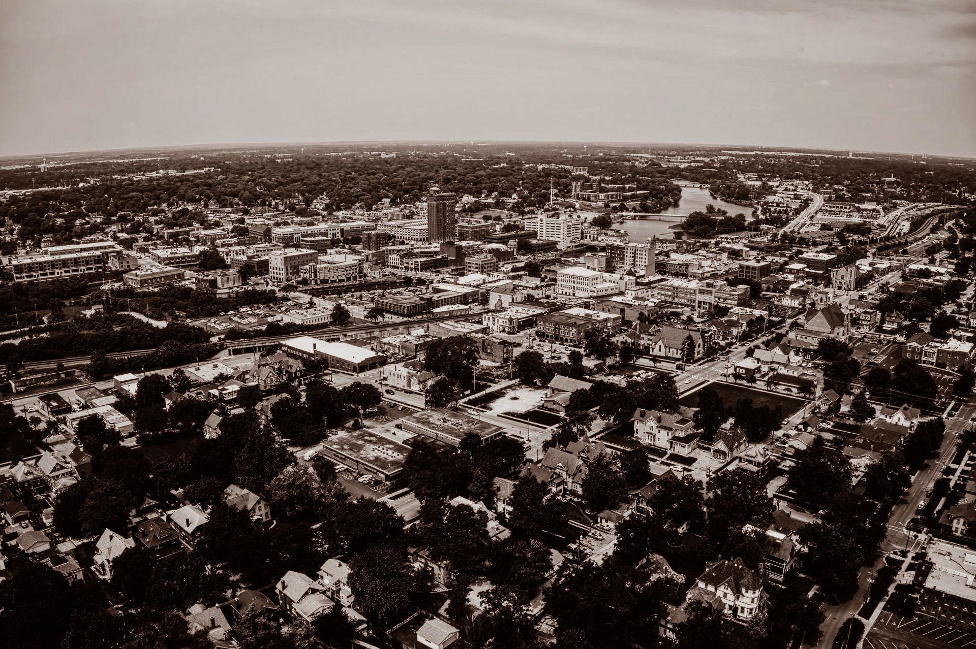 An aerial view of a city surrounded by trees