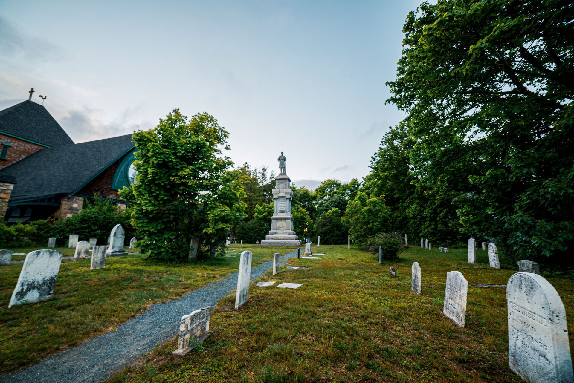 A cemetery with a church in the background