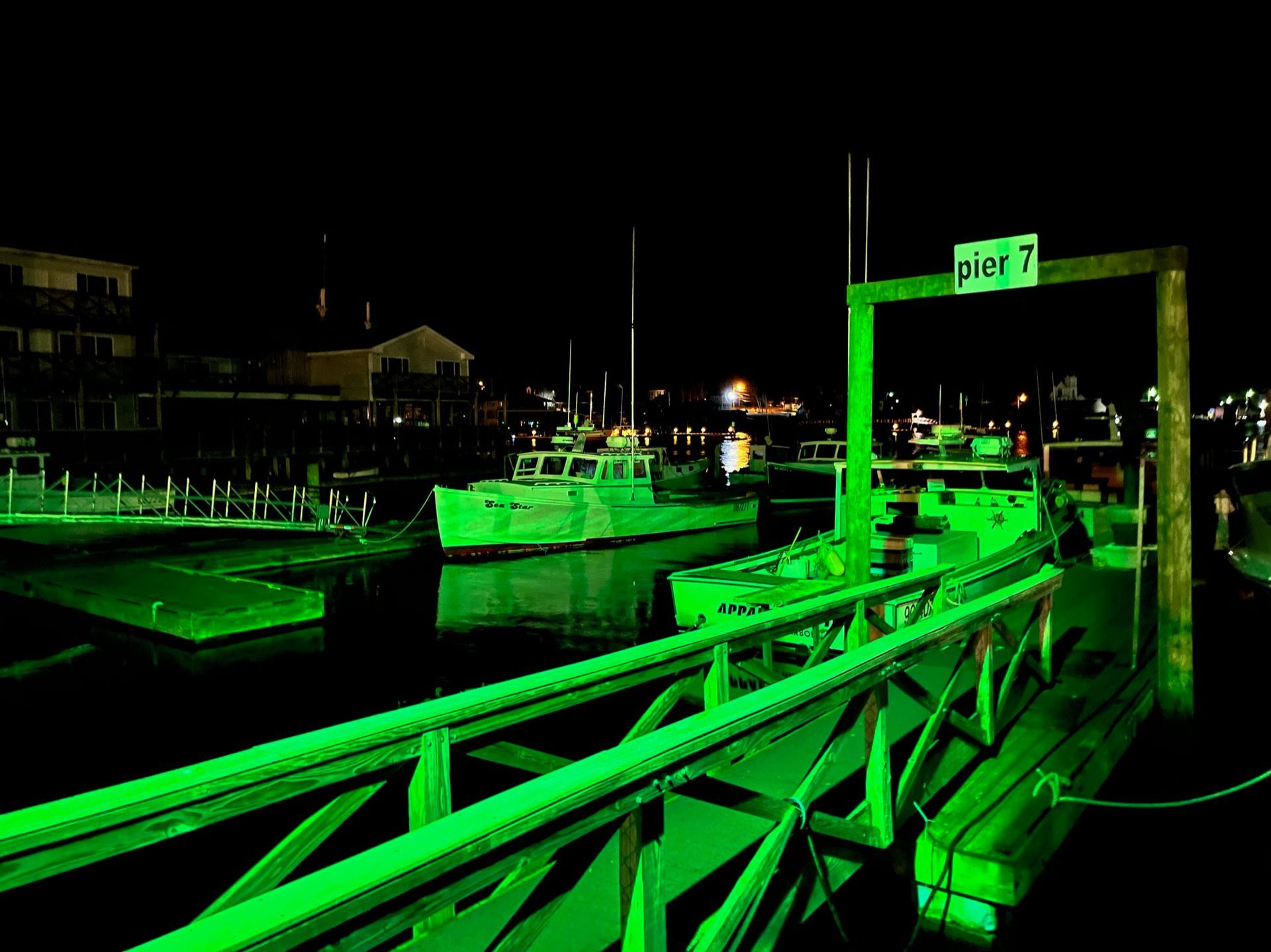 A green dock with a sign that says pw 7