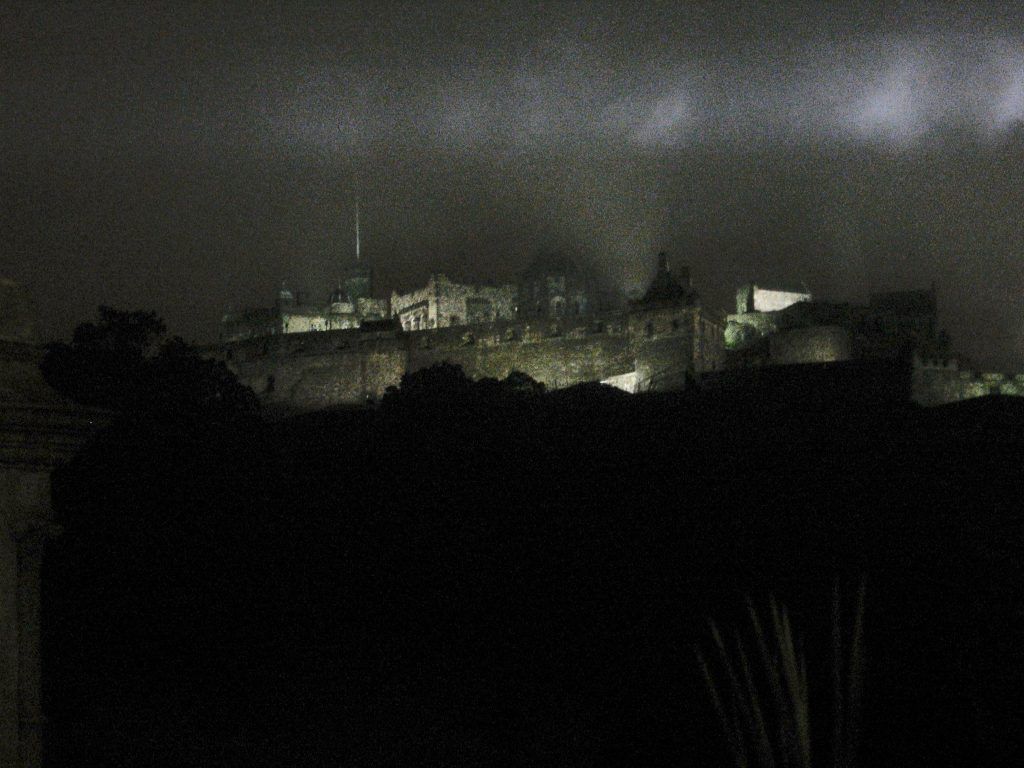 A black and white photo of a city at night