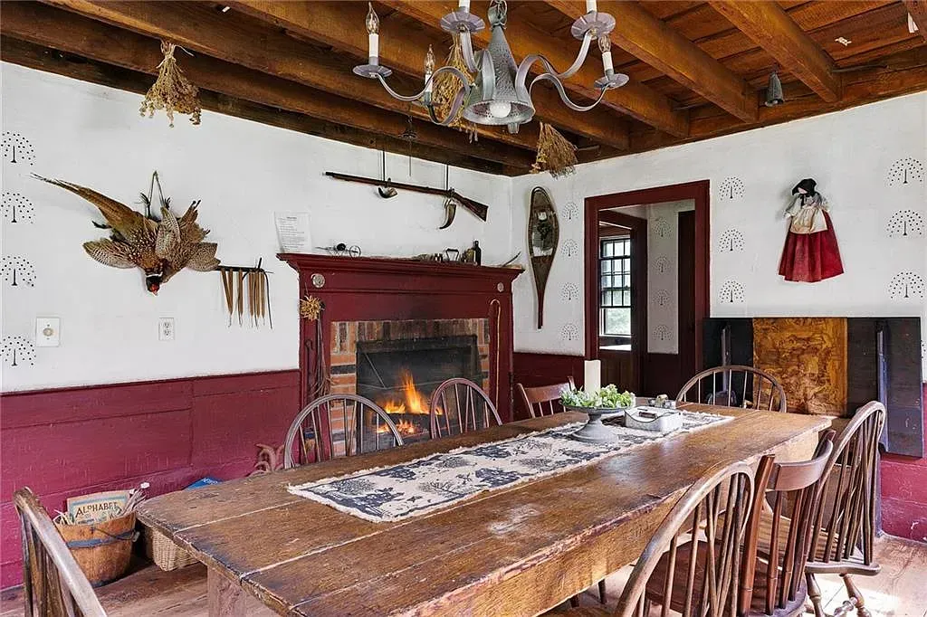 Conjuring House Interior Dining Room includes a beautiful fireplace and a scary taxidermied pheasant.