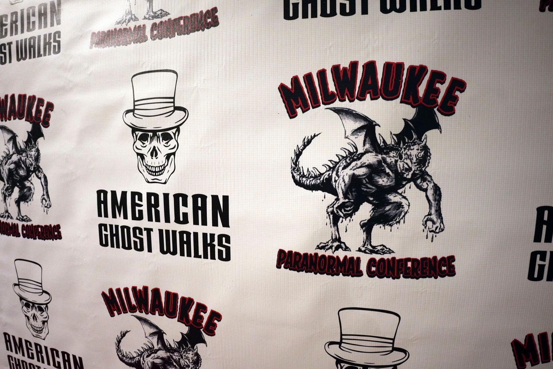 A white sheet of paper with a monster on it that says american ghost works