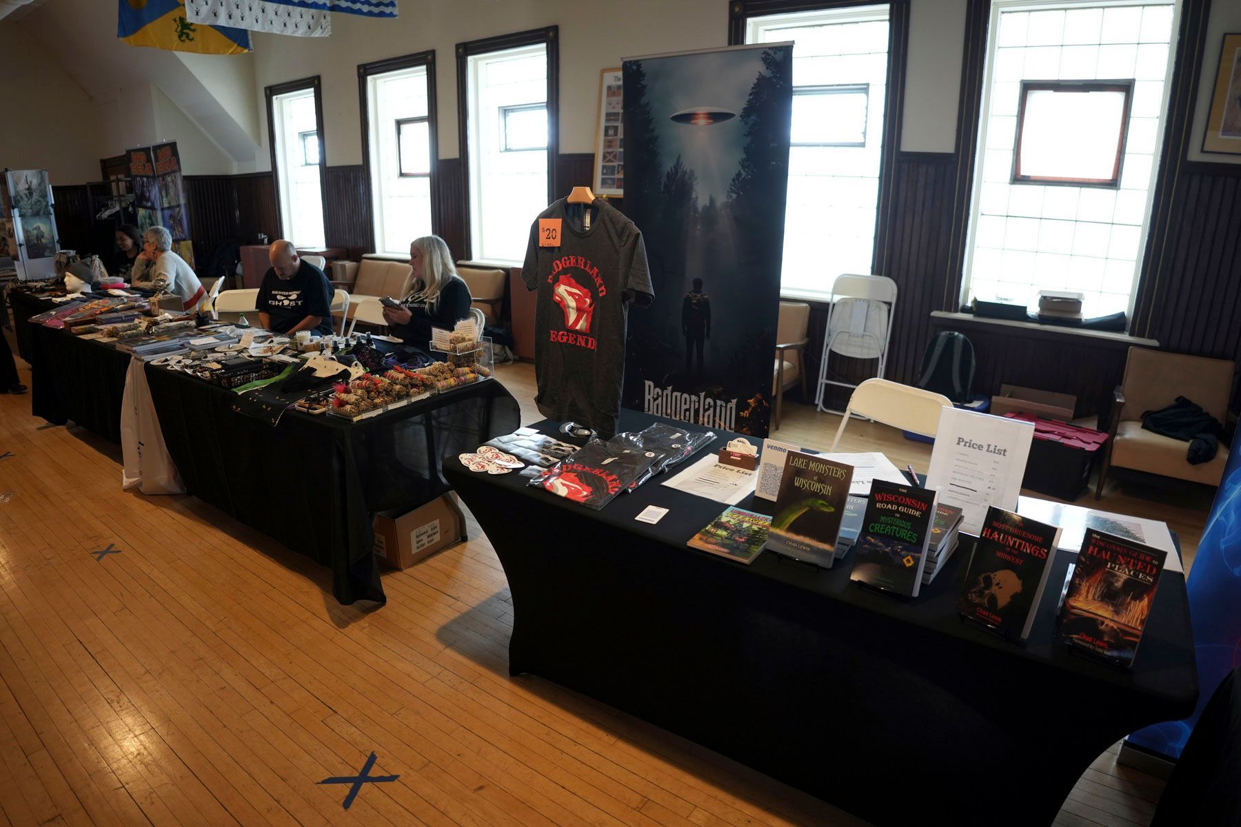 A table with a t-shirt on it that says ' x ' on it