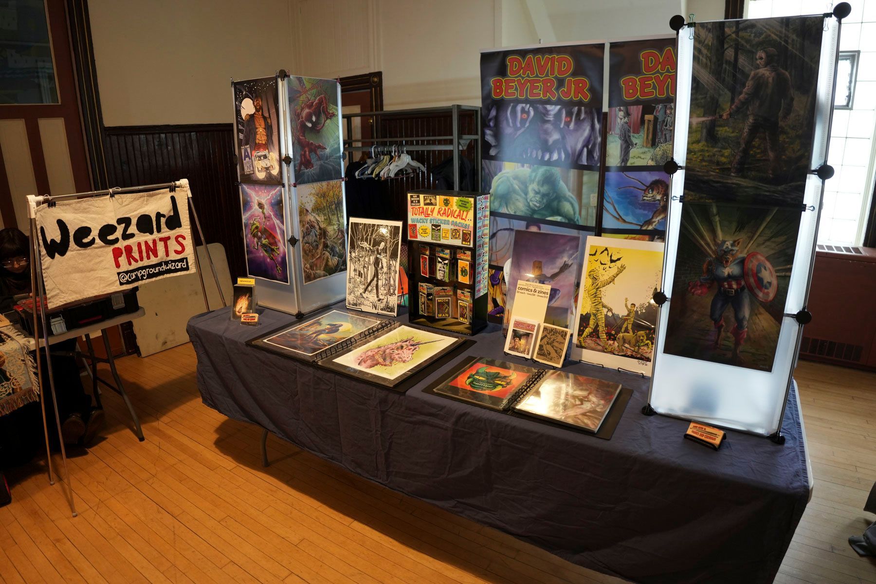 A table with a sign that says weezard prints on it