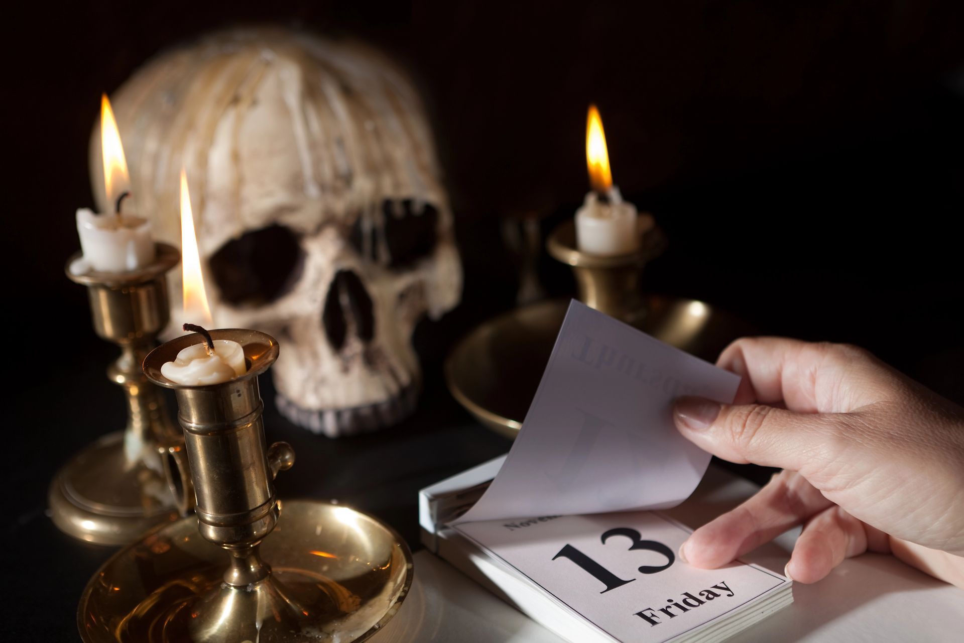 a skull and candle on friday the 13th
