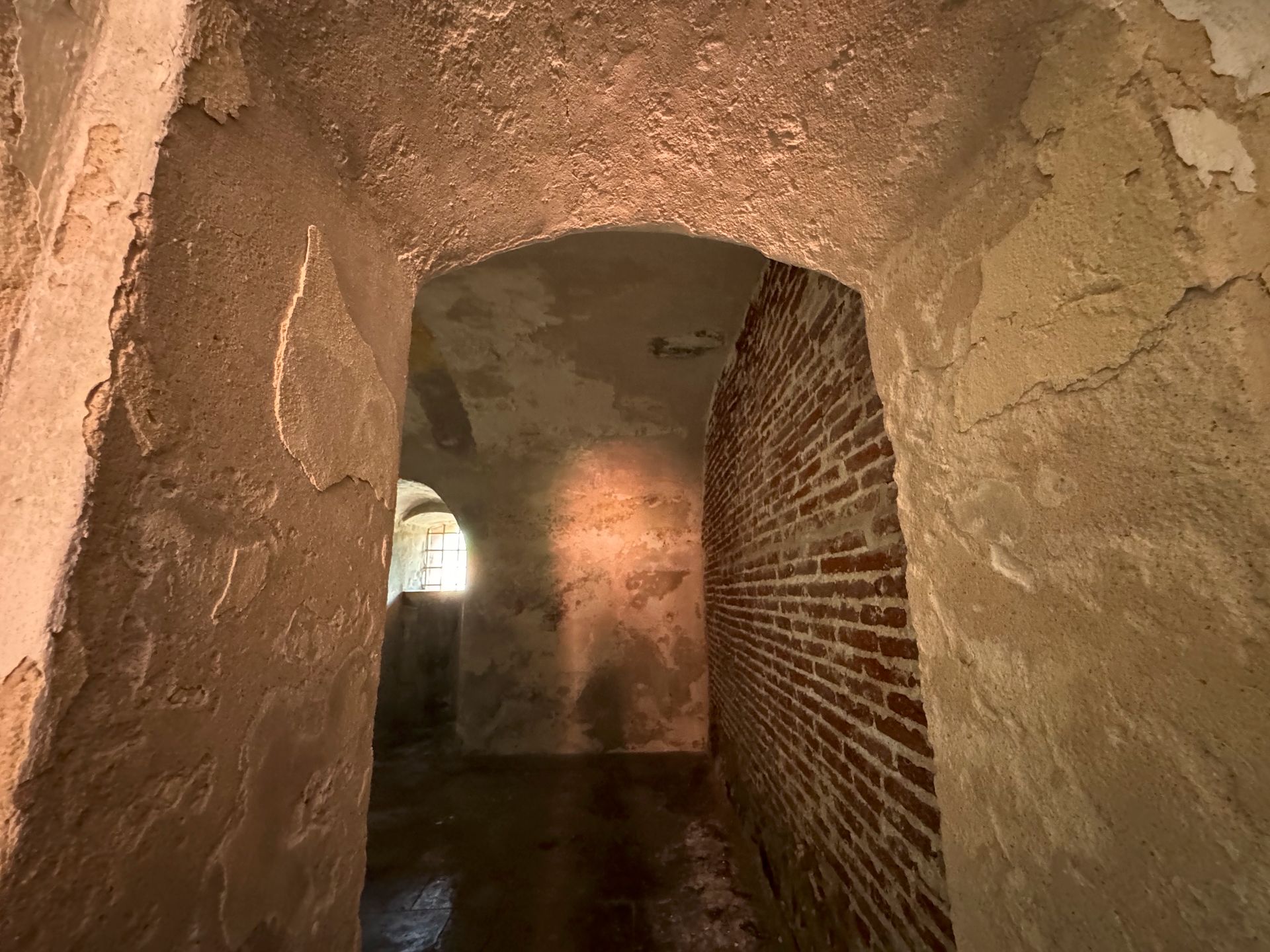 A group of people posing for a picture with one man wearing a red shirt that says ' nautica ' on it