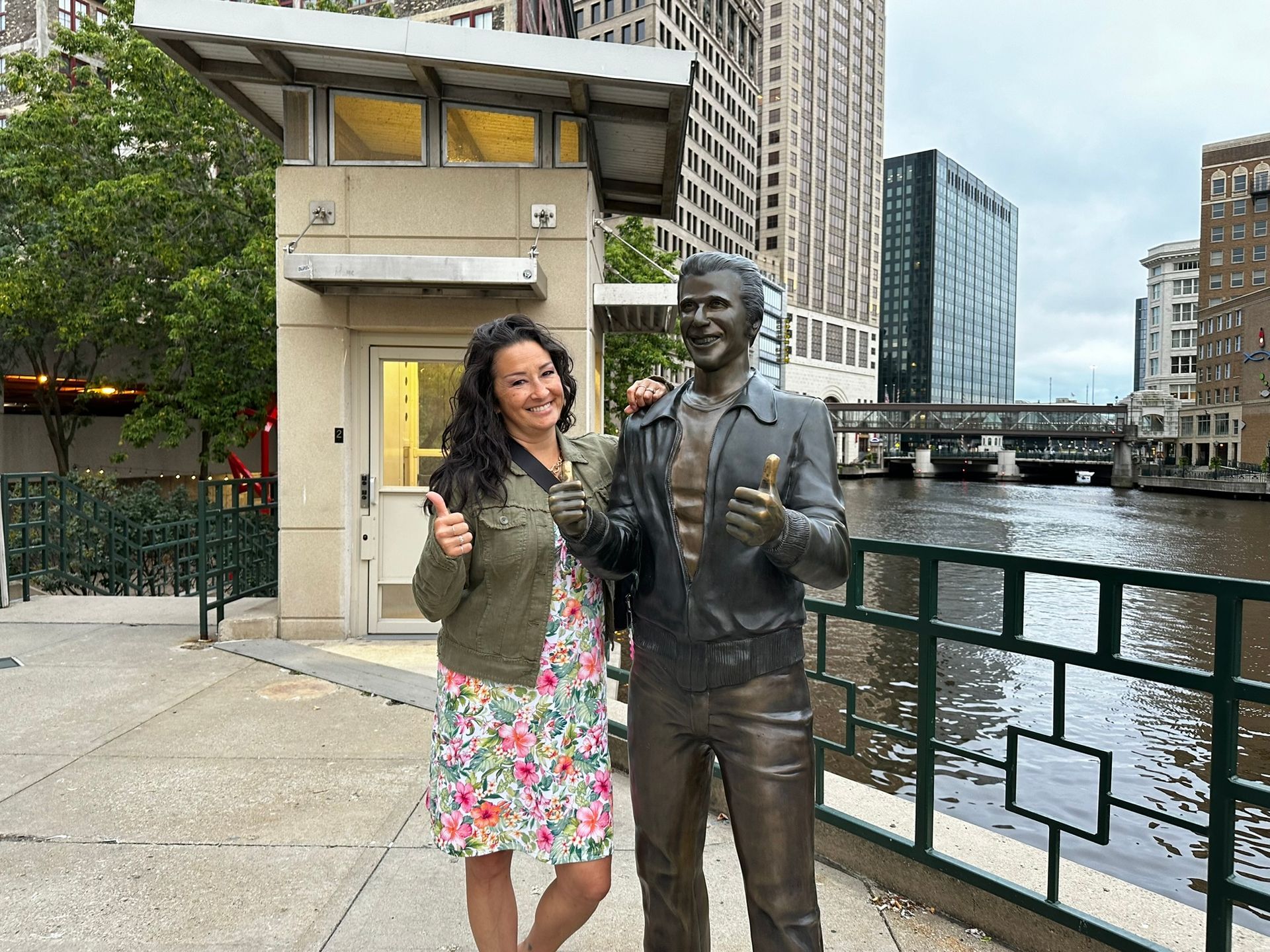 A happy ghost hunter visiting with the Bronze Fonz on our Shadow of City Hall Ghost Tour