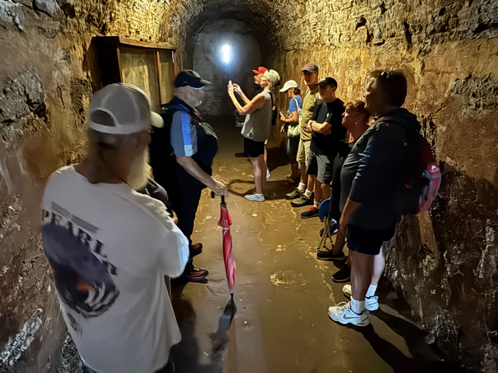 Exploring a dungeon in San Cristobal fort on a ghost walk in San Juan, Puerto Rico