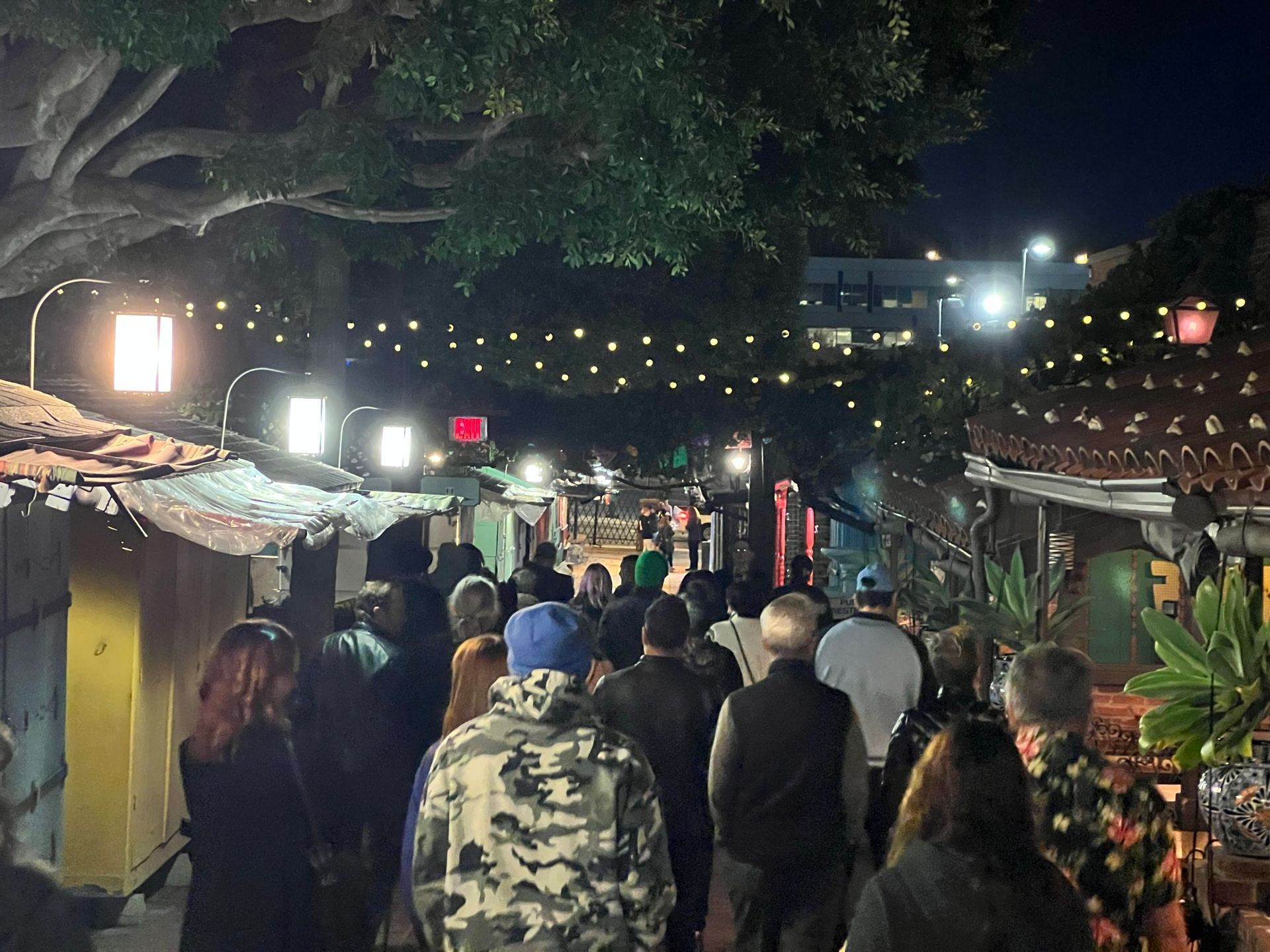 A private ghost tour corporate group exploring Olvera Street in Los Angeles, California