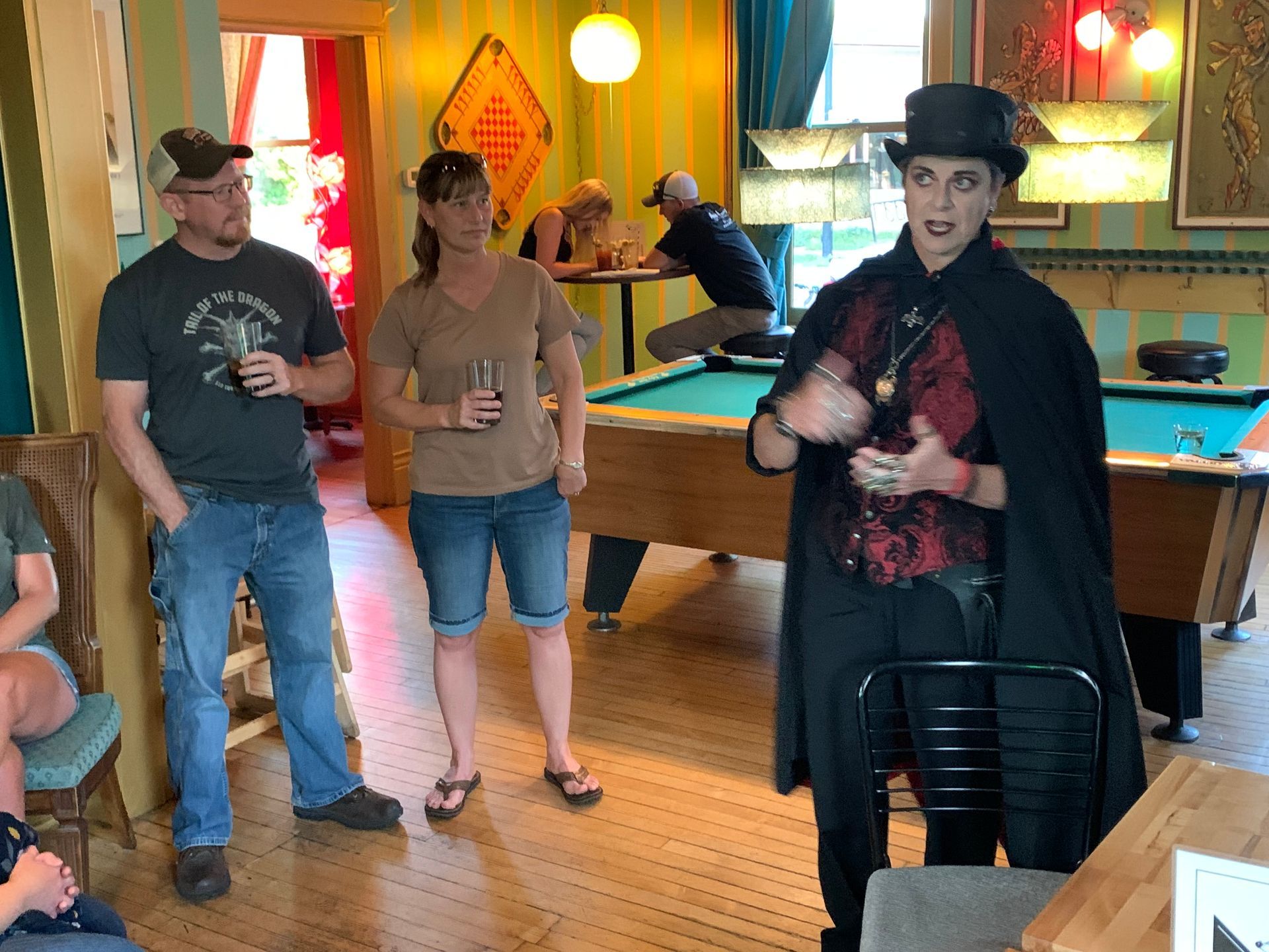 Ghost host Lisa Van Buskirk telling ghost stories in Mickey's old apartment at Mickey's Tavern